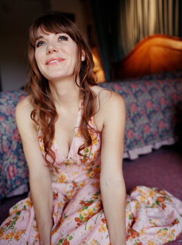 woman in floral dress smiling