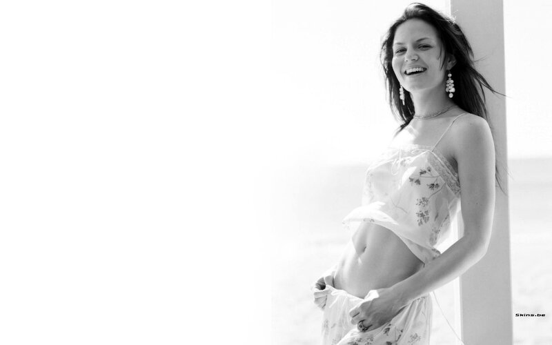 woman in floral dress smiling