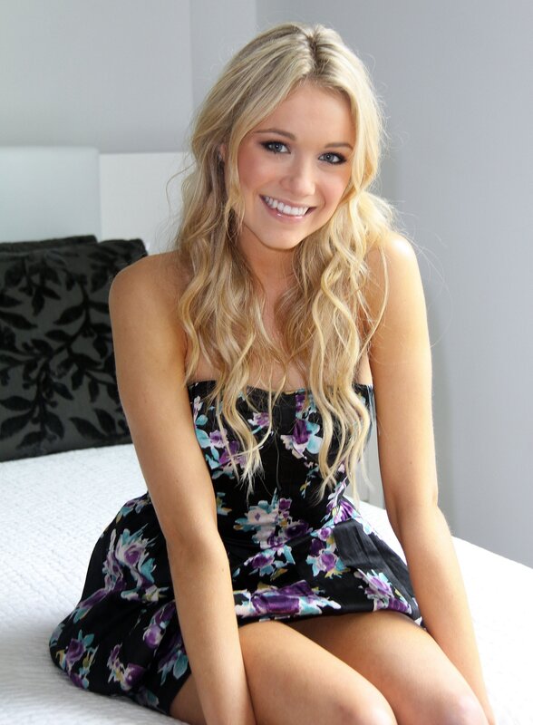 woman in floral dress smiling