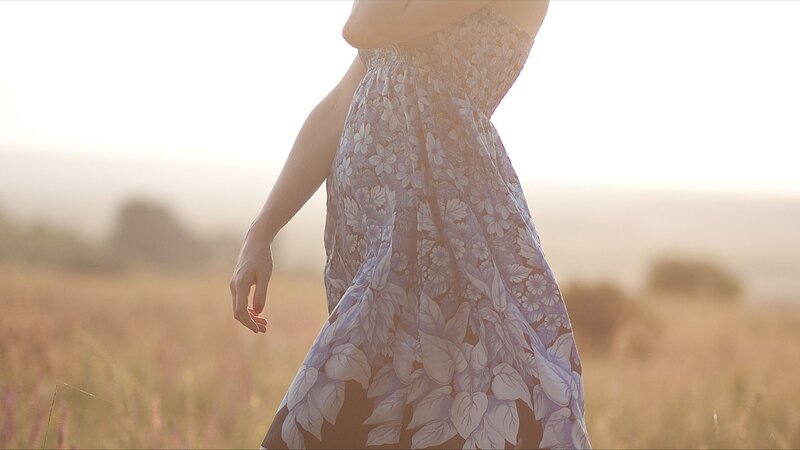 woman in floral dress walking