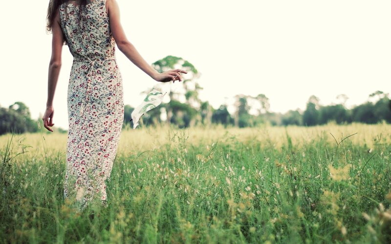 woman in floral dress walking