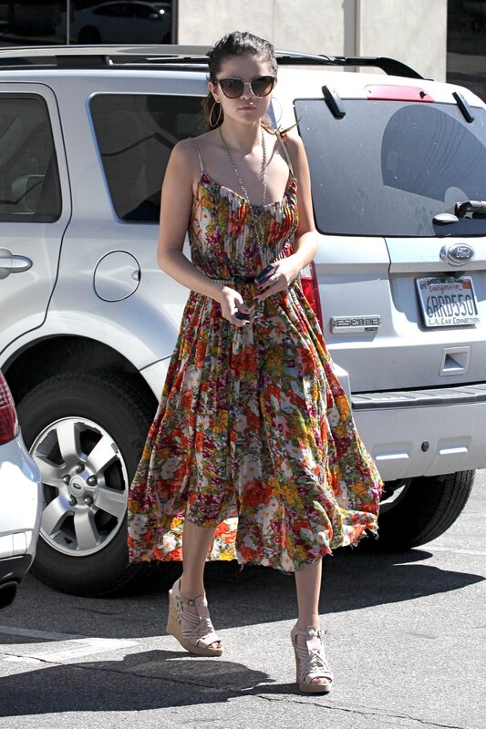 woman in floral dress walking