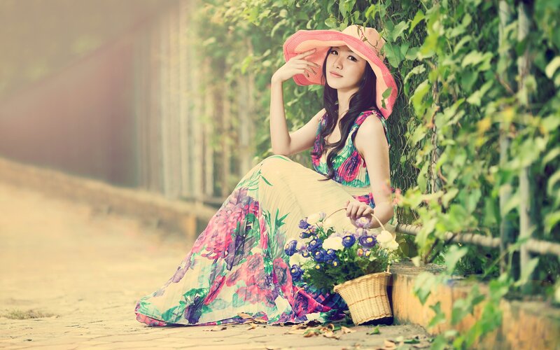 woman in floral dress with basket