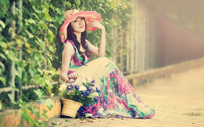 Woman in floral dress with basket