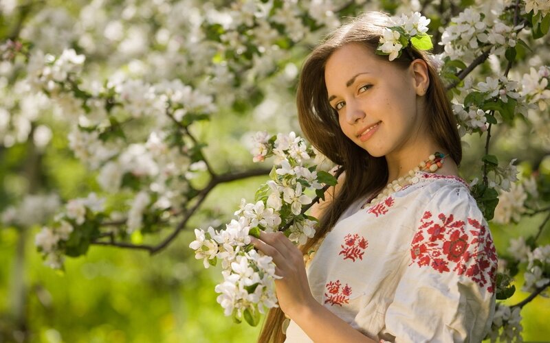 woman in floral dress with blossoms