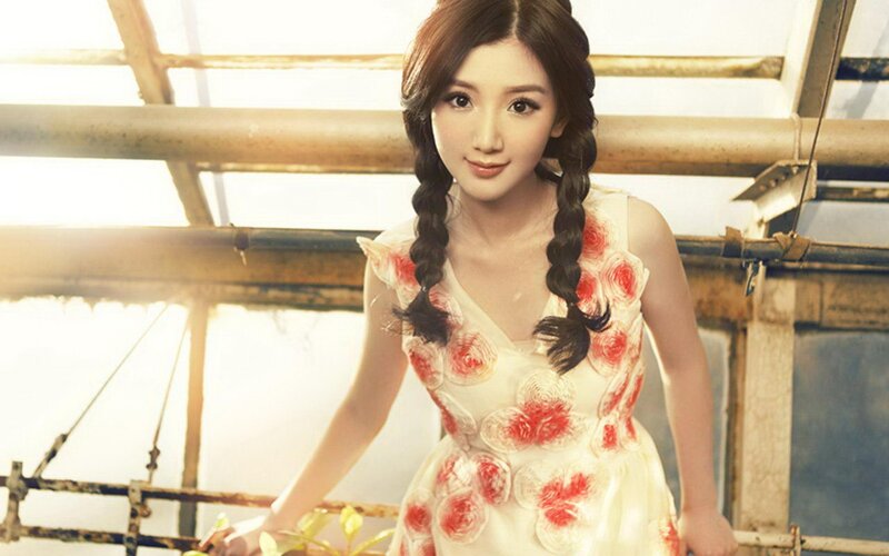 woman in floral dress with braids