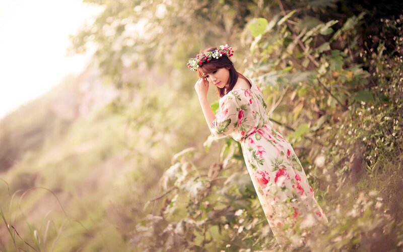 Woman in floral dress with crown