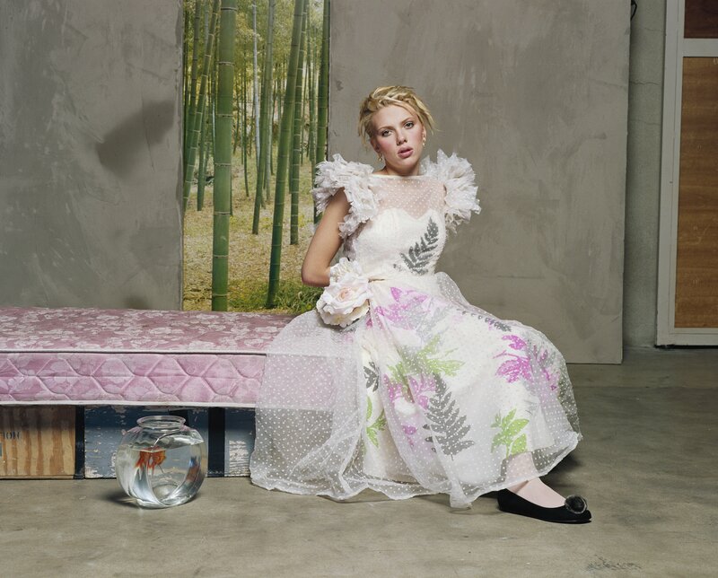 Woman in floral dress with fishbowl
