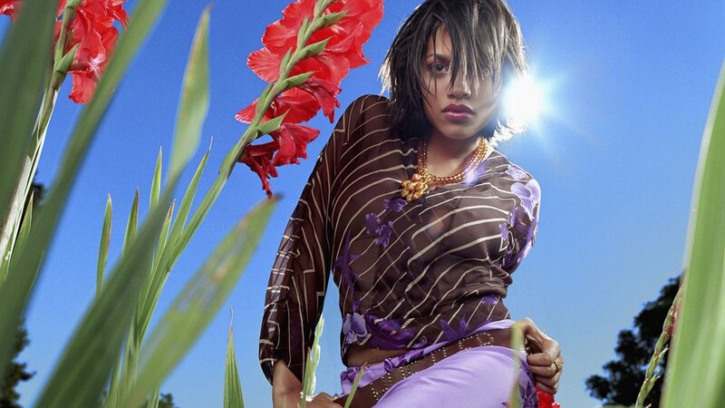 woman in floral dress with gladiolus