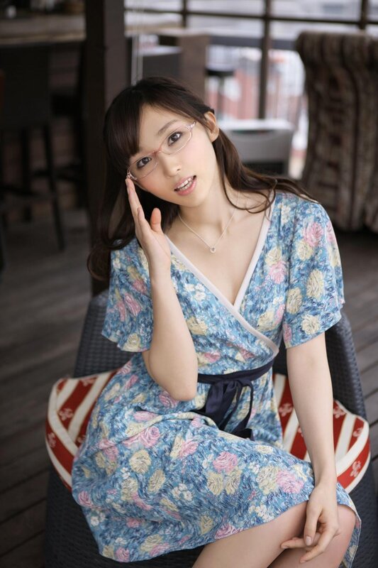 Woman in floral dress with glasses