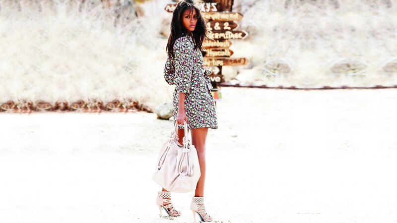 woman in floral dress with handbag