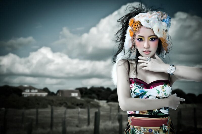 woman in floral dress with headpiece