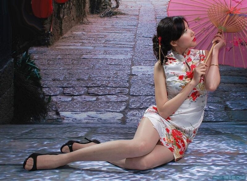 Woman in floral dress with parasol