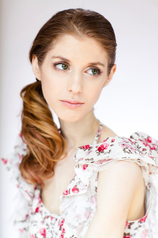 woman in floral dress with ponytail