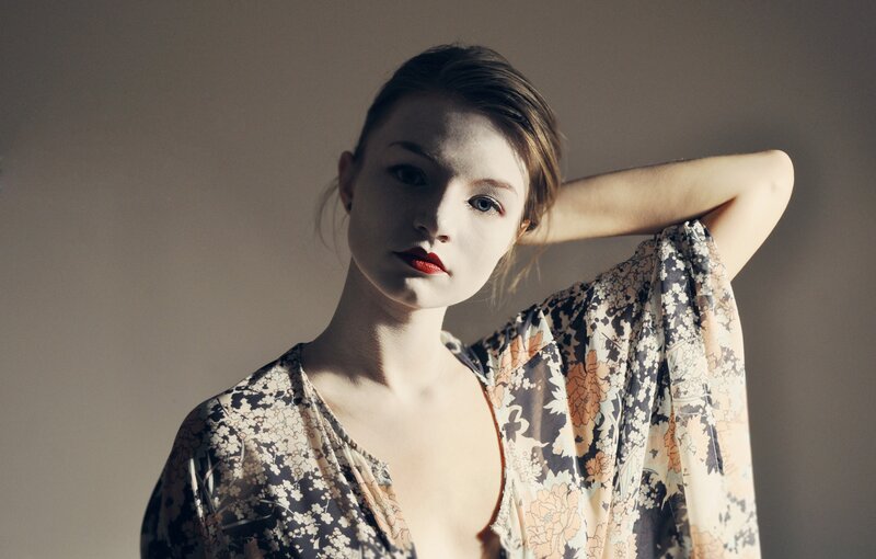 woman in floral dress with red lipstick