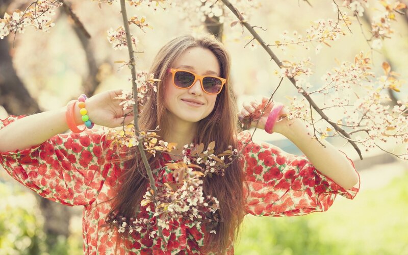 woman in floral dress with sunglasses