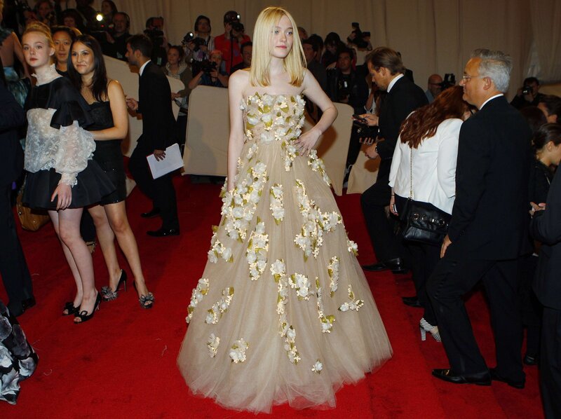 Woman in floral gown on red carpet