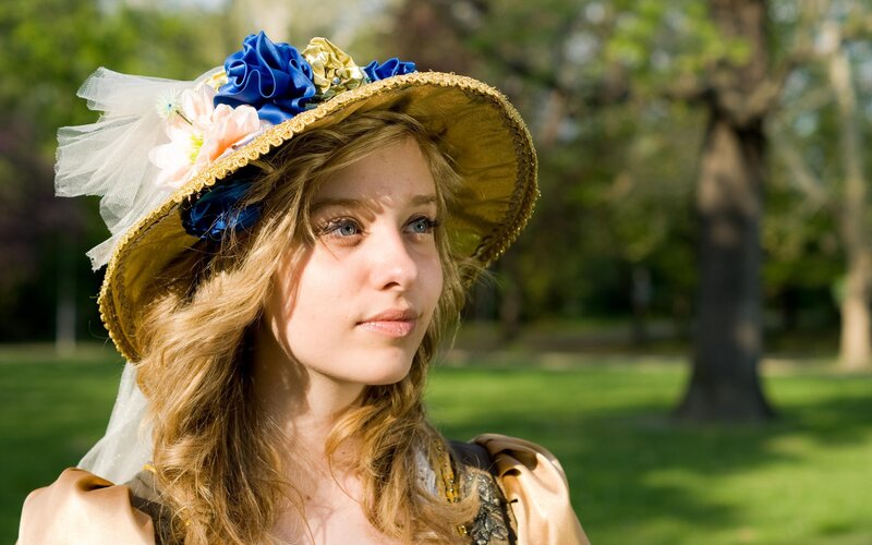 Woman in Floral Hat — Green, Serene, Afternoon