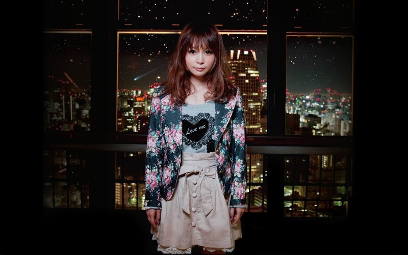 woman in floral jacket at night