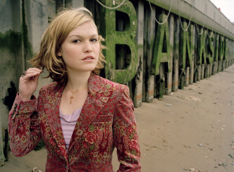 woman in floral jacket on beach