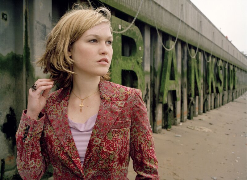 woman in floral jacket on pier