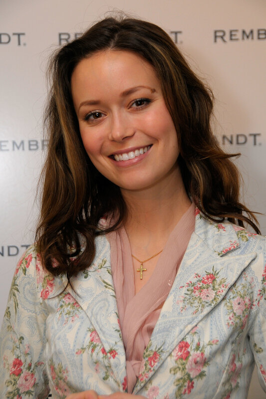 woman in floral jacket smiling