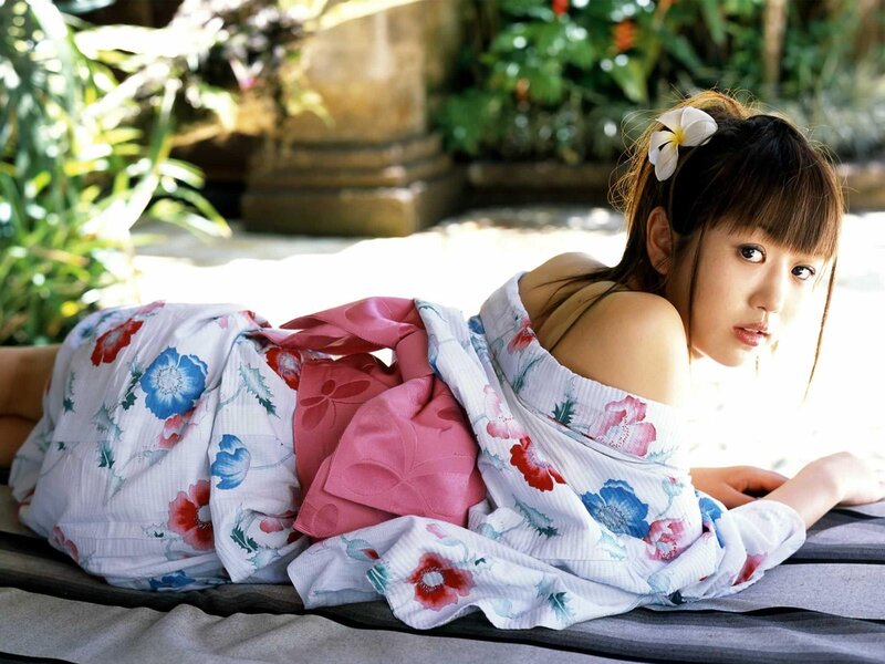 woman in floral kimono lying down