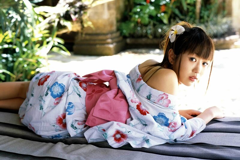 woman in floral kimono lying down