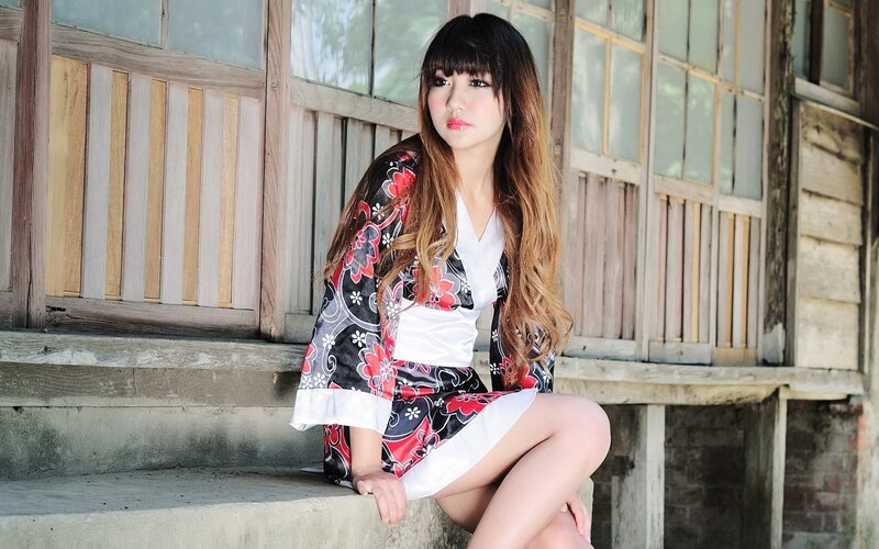 woman in floral kimono sitting