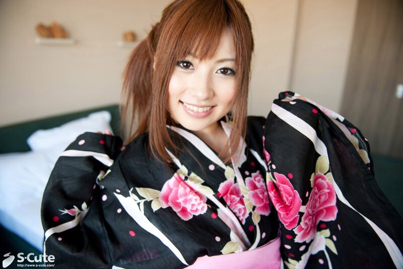 woman in floral kimono smiling