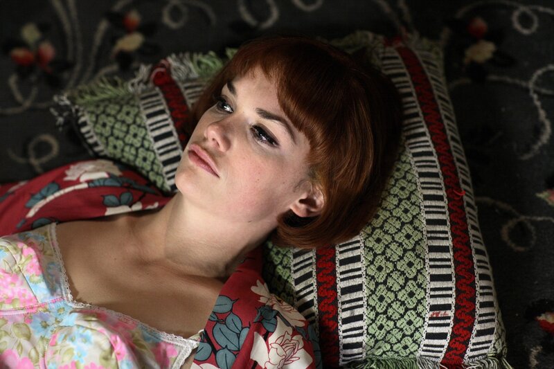 woman in floral pajamas lying down