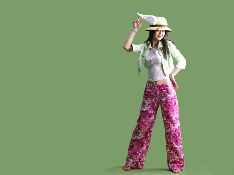 woman in floral pants and hat