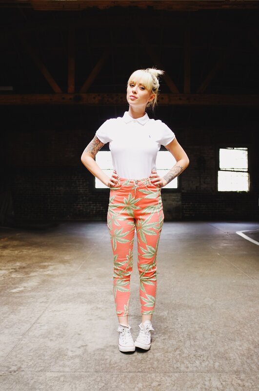 woman in floral pants standing