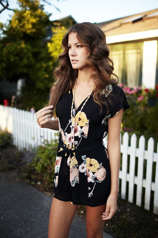woman in floral romper
