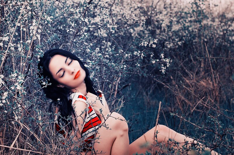 Woman in floral setting