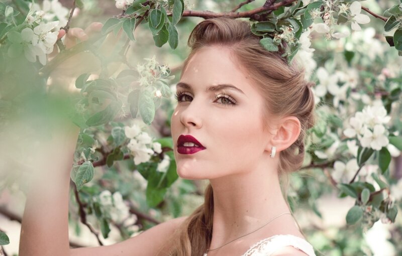 Woman in Floral Setting — White
