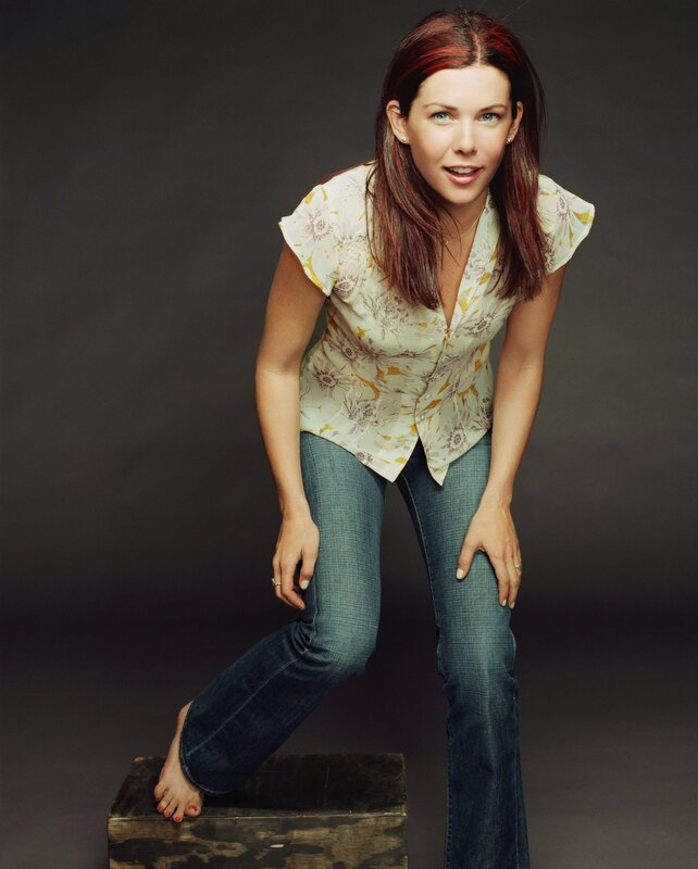 woman in floral shirt and jeans