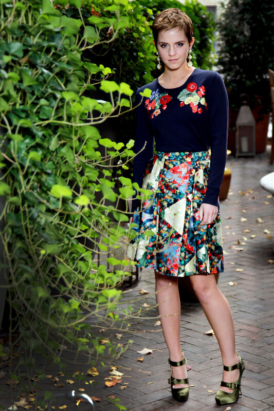 woman in floral skirt and sweater