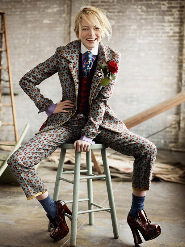 woman in floral suit sitting