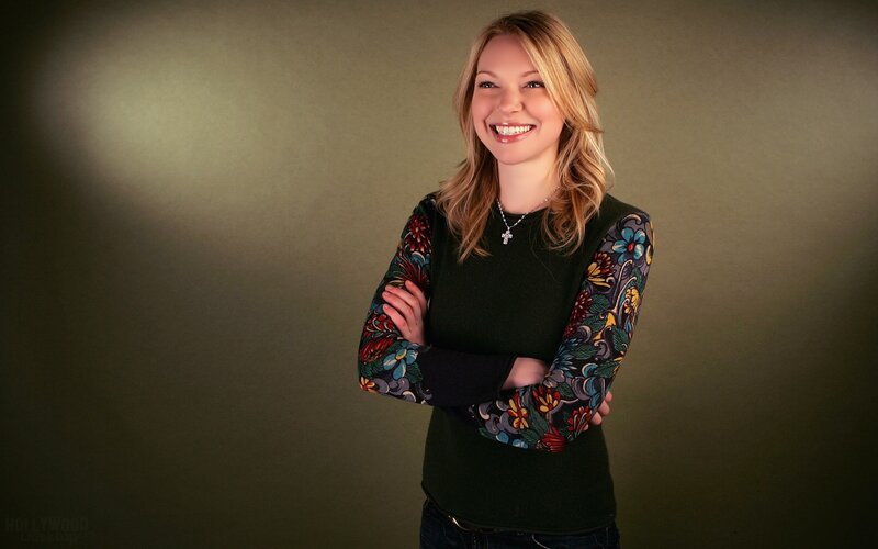 woman in floral sweater smiling