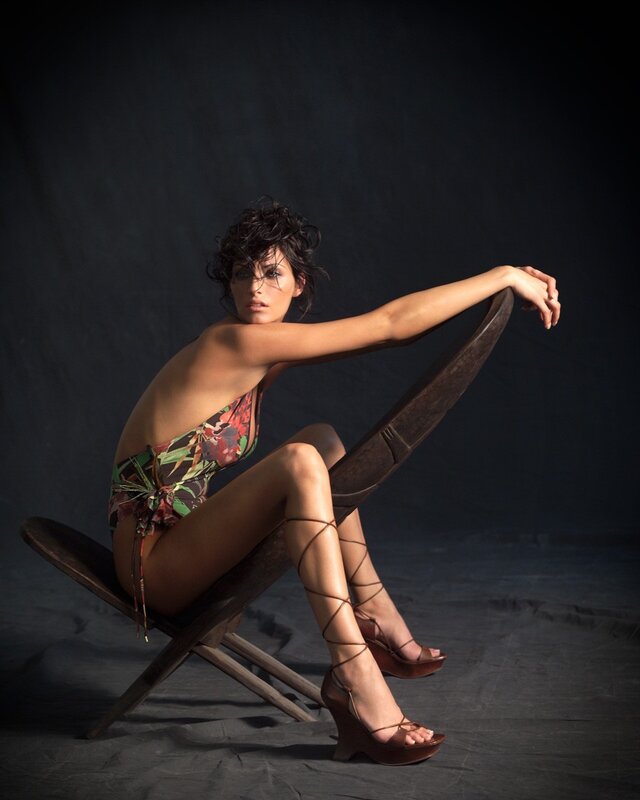 Woman in floral swimsuit on chair