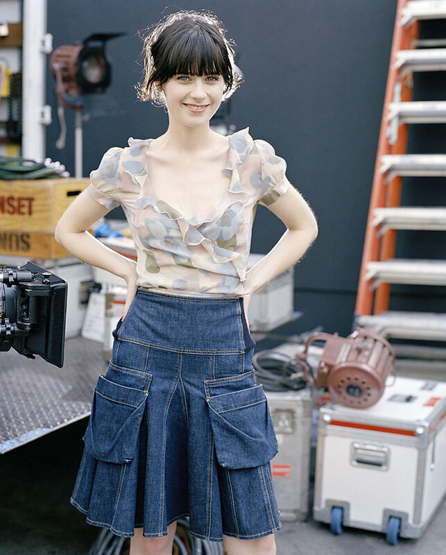 woman in floral top and denim skirt