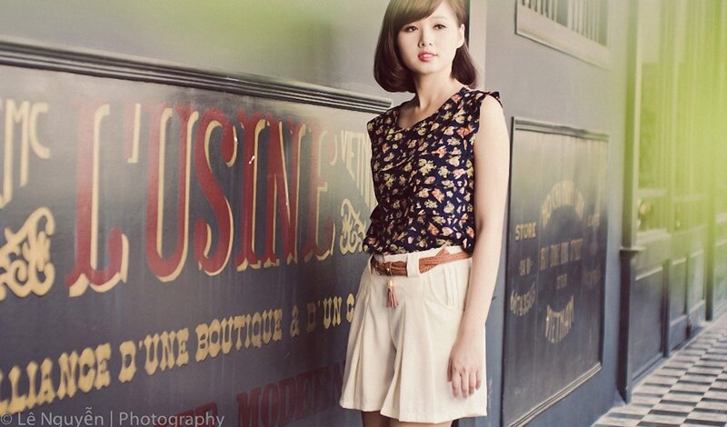 woman in floral top and shorts