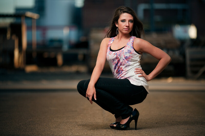 woman in floral top crouching