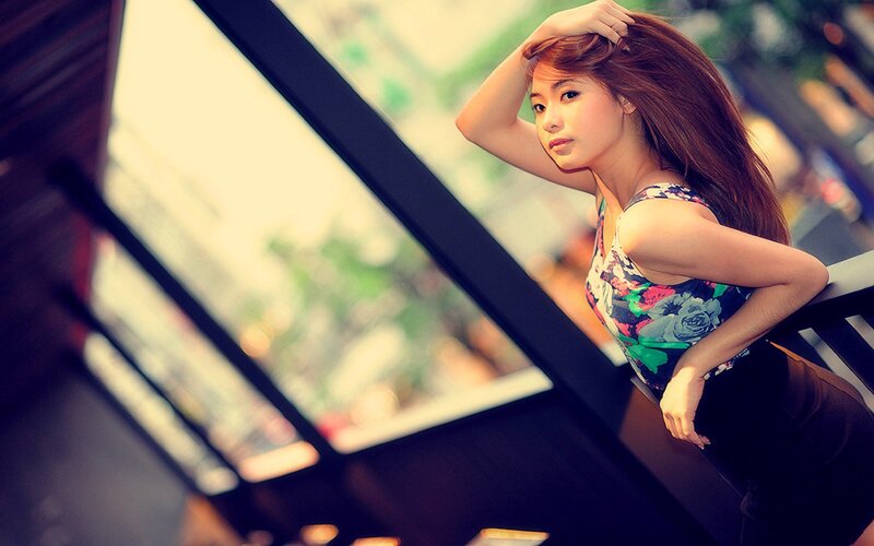 woman in floral top leaning