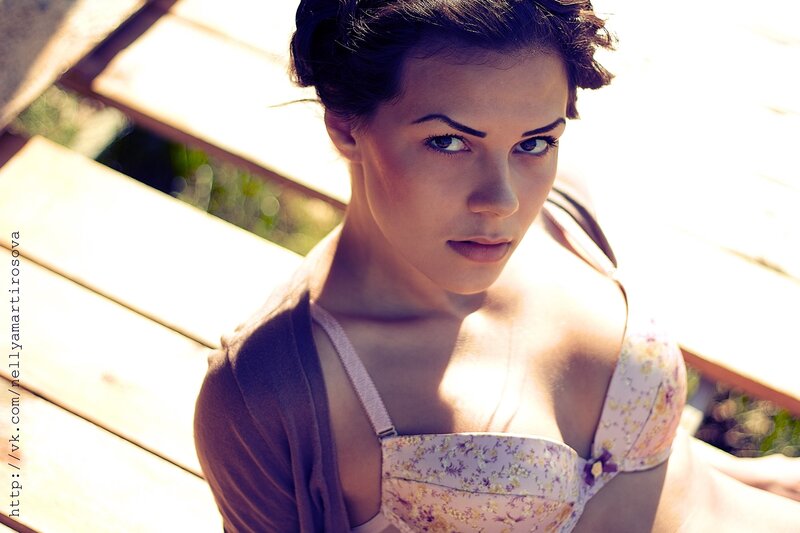 woman in floral top looking at camera
