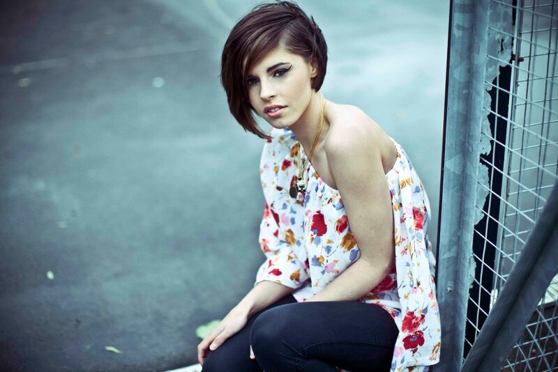 woman in floral top sitting