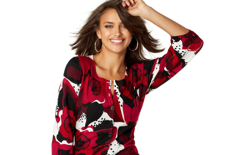 woman in floral top smiling