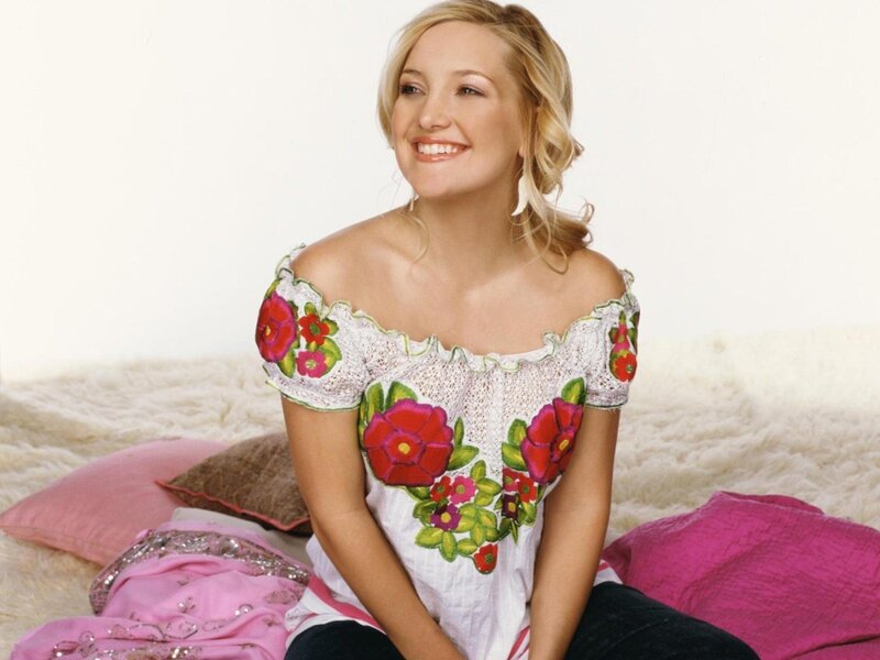 woman in floral top smiling