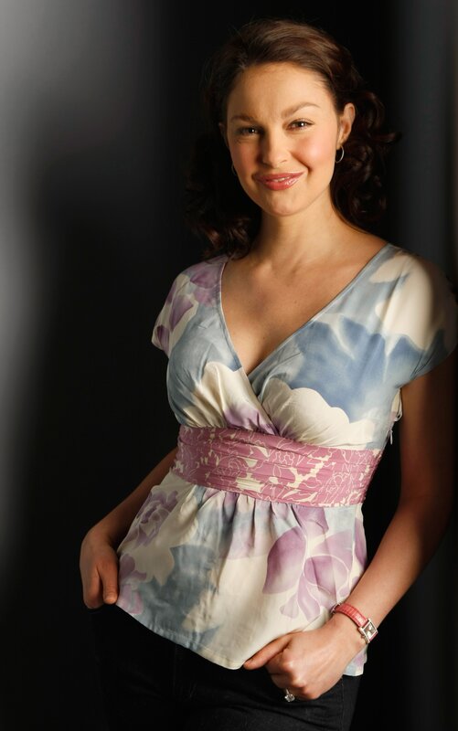 woman in floral top smiling